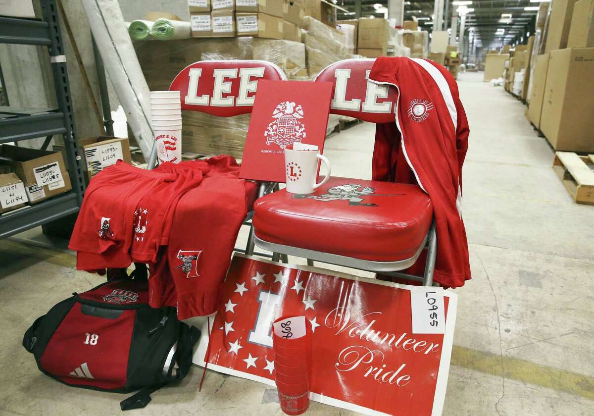 Auction numbers decorate a display as North East ISD employees sort through Lee-branded items from Robert E. Lee High School on July 11, 2018.