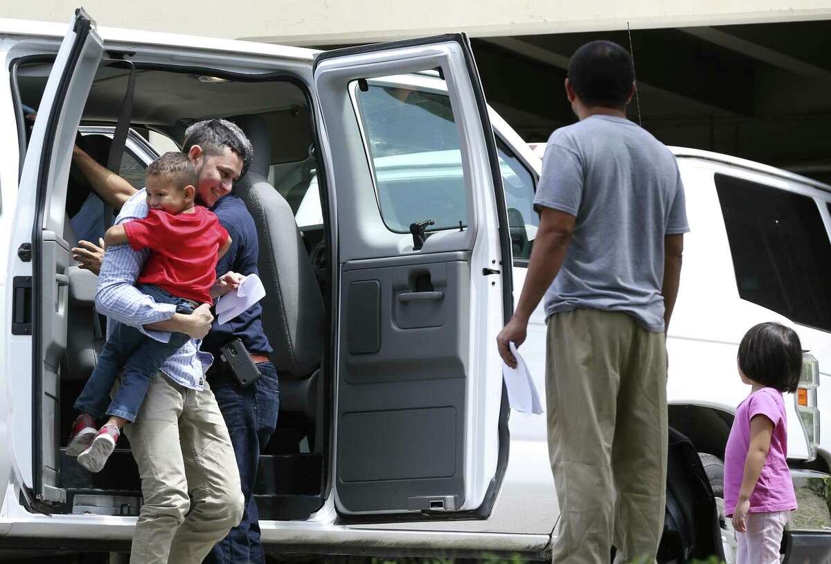 Immigrant families arrive at the Archdiocese of San Antonio Catholic Charities offices in San Antonio, Wednesday, July 11, 2018. Earlier the families left a U.S. Immigration and Customs Enforcement facility after they were reunited overnight.