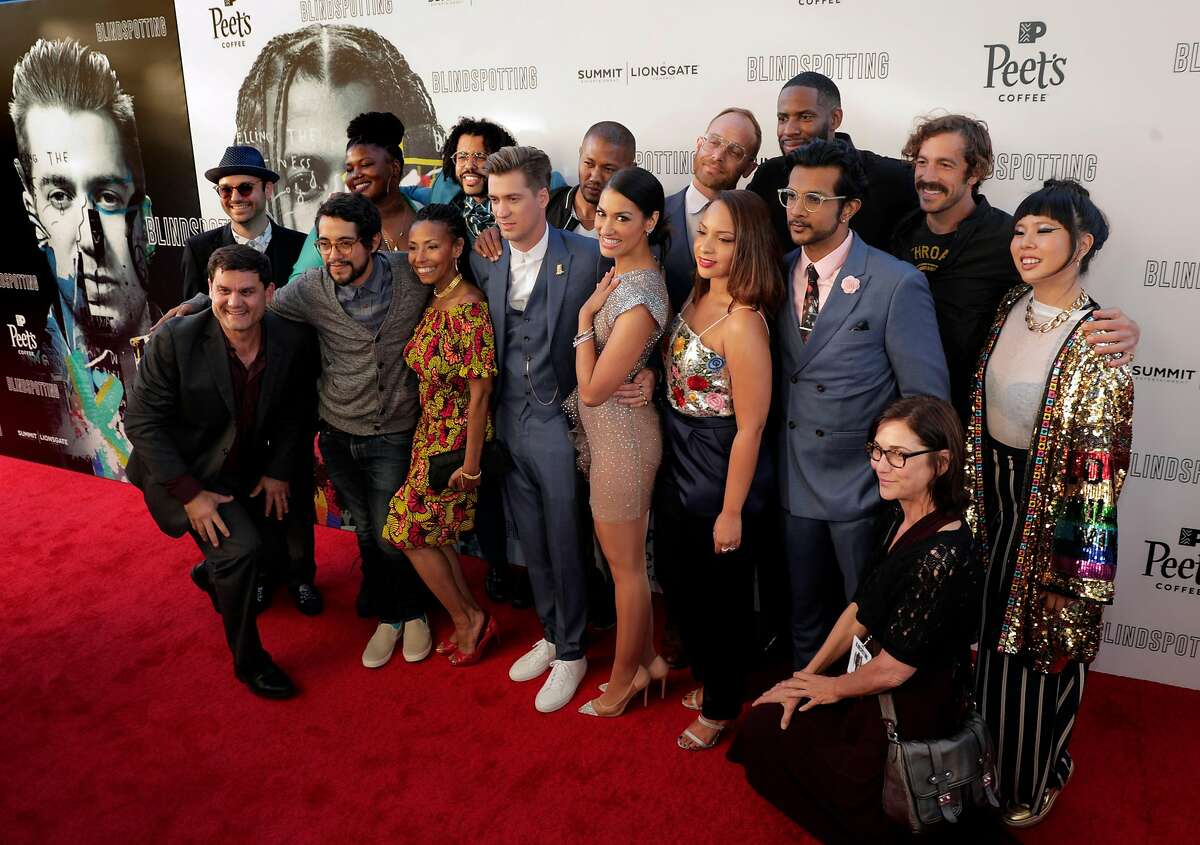 Cast and executives pose at the red carpet premiere of "Blindspotting," at the Grand Lake Theater in Oakland, Calif., on Wednesday, July 11, 2018. Lifelong friends Daveed Diggs and Rafael Casal co-wrote and star the film which is based in Oakland and filmed throughout the Bay Area.