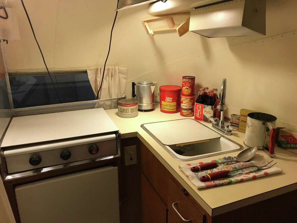 Most of the RVs at the Jack Sisemore Traveland RV Museum include items appropriate to the vintage of the unit including this 1962 Airstream Bambi with a kitchen stocked with coffee, peanut butter, a can of Donald Duck grapefruit sections and utensils.