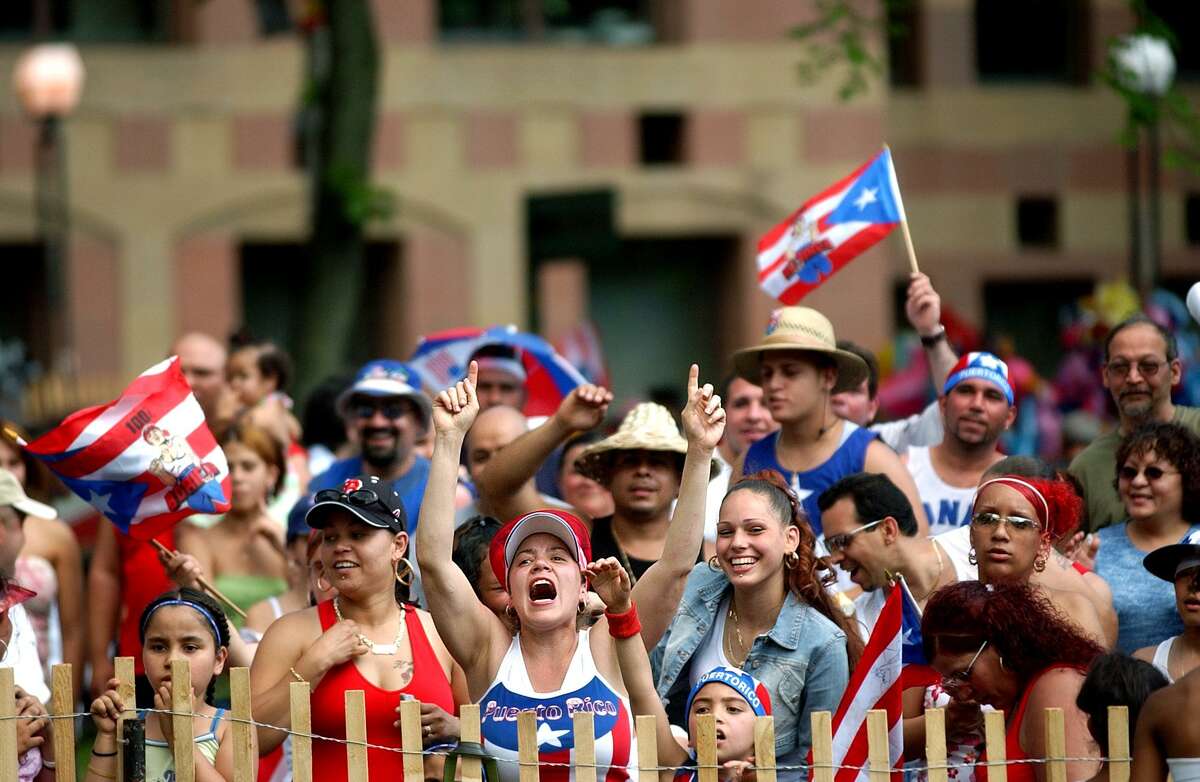 Fans enjoy the music during the Puerto Rican Day Festival Sunday in New Haven.  volpe file photo