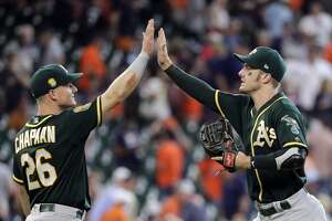 A’s rally for another win at Houston, take series - Photo