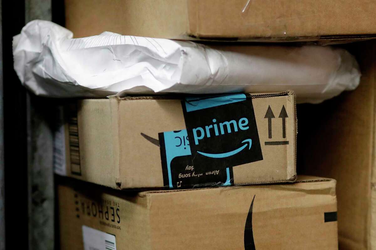 FILE- In this May 9, 2017, file photo, a package from Amazon Prime is loaded for delivery in New York. Amazon's Prime Day starts July 16, 2018, and will be six hours longer than last year's and will launch new products. (AP Photo/Mark Lennihan, File)