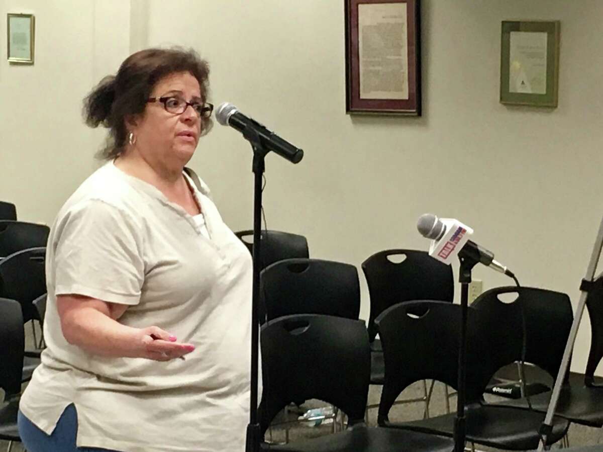 Alice Senrick of East Schodack talks Thursday during a public hearing at the Schodack Town Hall on Amazon's proposed fulfillment center on Route 9. The county is considering providing the project with $13.7 million in tax breaks