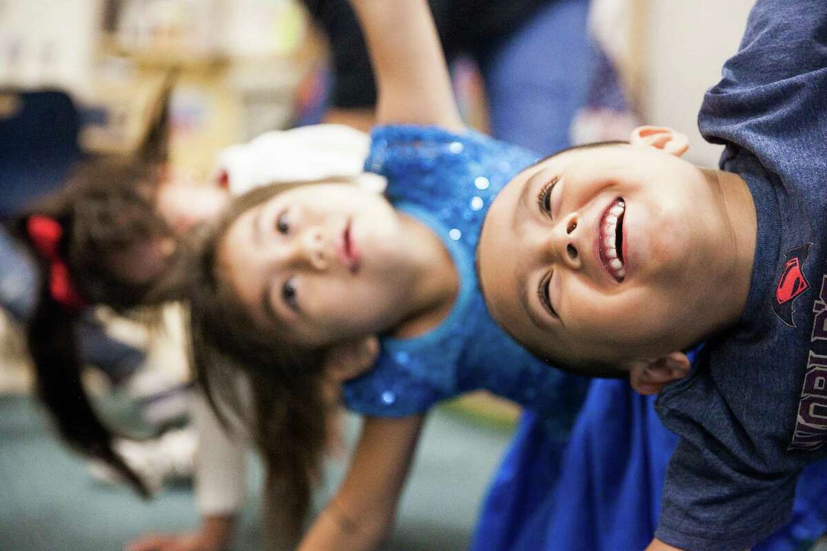 Ivan Torres, 4, stretches alongside his classmates during a movement session where the children have time to dance and move before starting their day Friday May 6, 2016 during Master Teacher Marielos Romero's bilingual class at the Pre-K 4 SA South Education Center. This facility is one of four education centers around the city. Rep. Joaquin Castro is trying to take the concept of Pre-K for SA to a national level, targeting Los Angeles, San Francisco and Denver are three cities that are targeted.