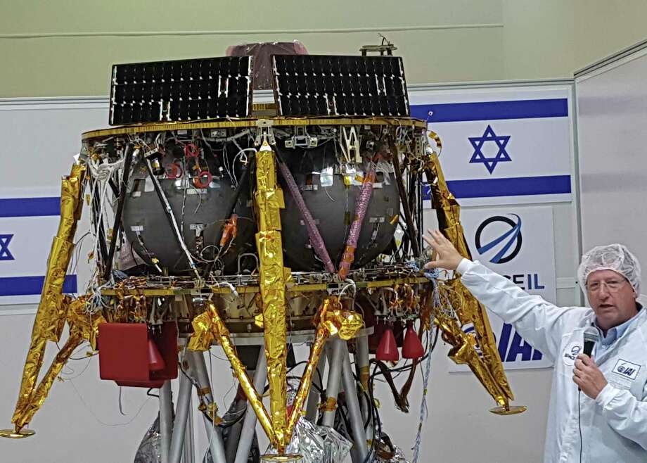 PHOTOS: Go exploring Opher Doron, general manager of Israel Aerospace Industries' space division, speaks beside the SpaceIL lunar module during a press tour of their facility near Tel Aviv, Israel, in July. NASA officials said Wednesday that they will work with Israel on a probe slated to reach the moon in February. >>Don't wait for the probe to get there to see what the lunar landscape has to offer. Here's what moons planets you can explore through Google... Photo: Ilan Ben Zion, Associated Press / Copyright 2018 The Associated Press. All rights reserved.