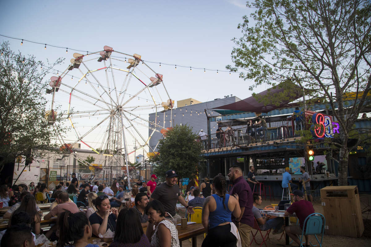 The Ferris wheel adds a touch of whimsy to the outdoor setting of Truck Yard in EaDo.
