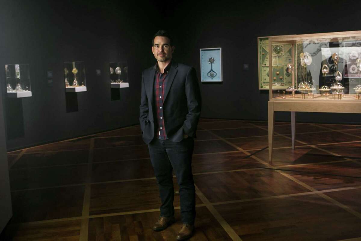 Dario Robleto poses in his show “Ancient Beacons Long for Notice” at the McNay June 28, 2018. This is the McNay’s first major presentation of works by Robleto, a San Antonio native who lives in Houston but increasingly works around the U.S. with scientists, engineers and academics in a variety of fields.