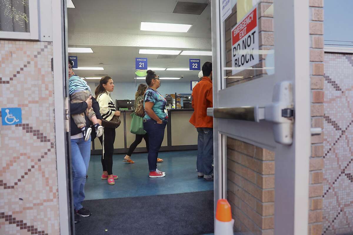 Line seen for already scheduled appointments at the State Department of Motor Vehicles on Thursday, July 5, 2018 in San Francisco, Calif. YoGov, an Oakland company that promises �expedited appointments� at field offices at a time when lines at the DMV are getting longer and appointments harder to schedule.