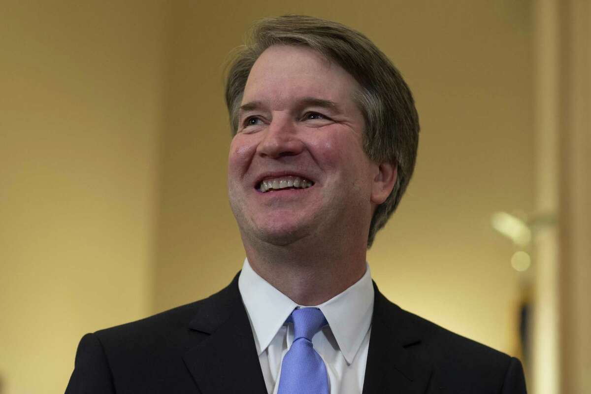 Judge Brett Kavanaugh (L) smiles prior to a meeting with Sen. Benjamin Sasse (R-NE) in the Russell Senate Office Building on July 12, 2018 in Washington, DC. Kavanaugh is meeting with members of the Senate after U.S. President Donald Trump nominated him to succeed retiring Supreme Court Associate Justice Anthony Kennedy.