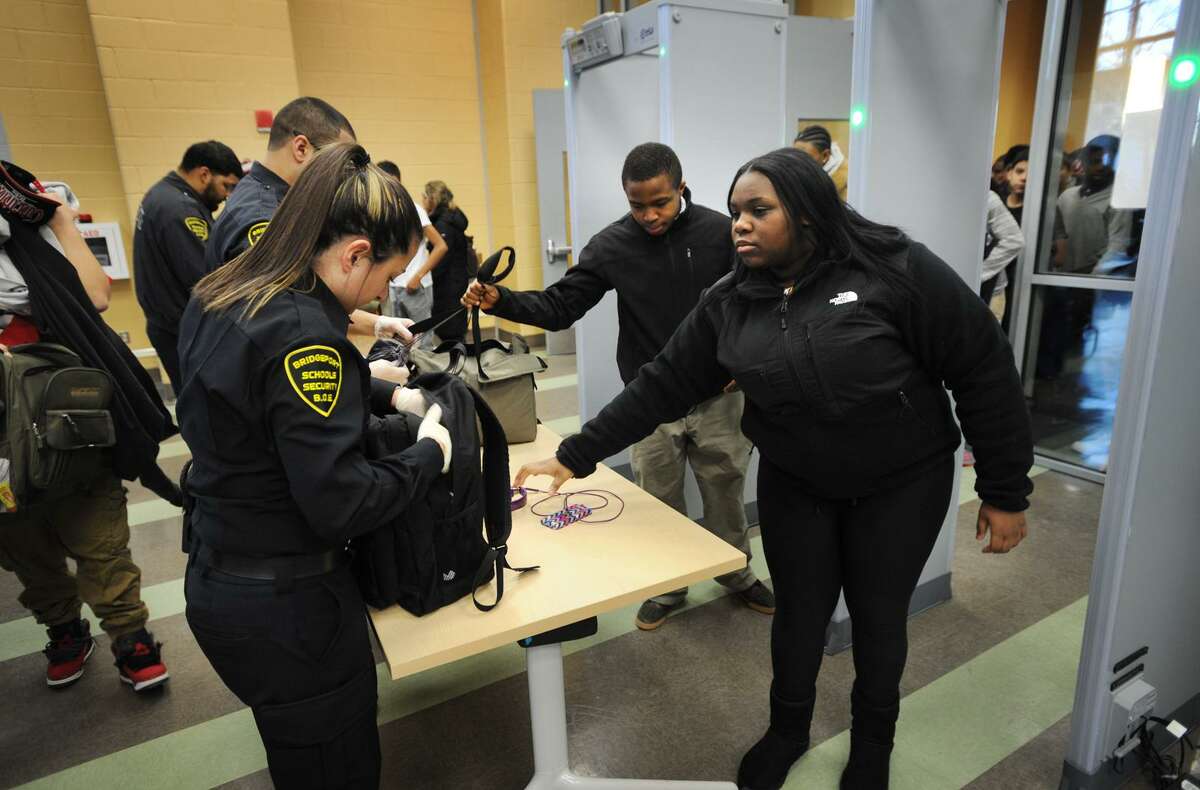 Students have their backpacks searched and pass through metal detectors at the start of the school day at the Fairchild Wheeler Interdistrict Magnet School in Bridgeport, Conn. on Thursday, January 29, 2015.