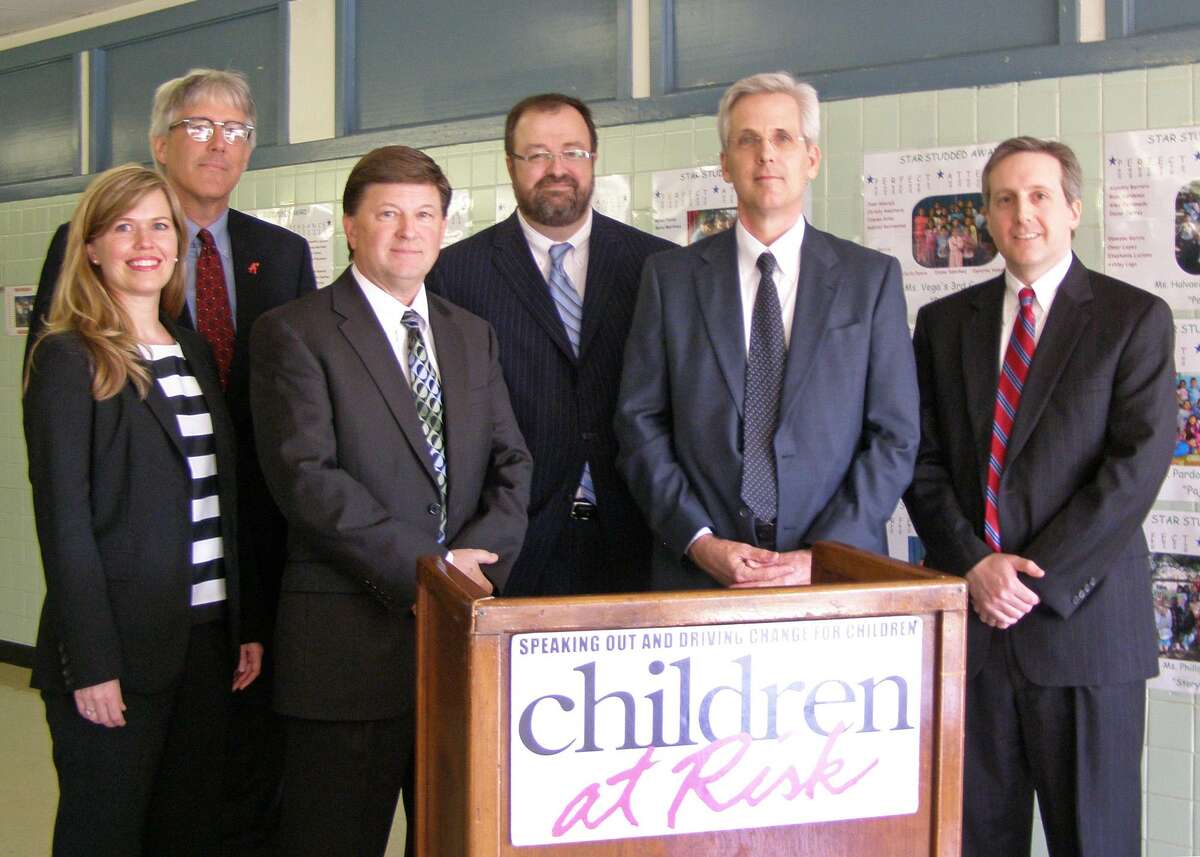 Pearland Independent School District superintendent Dr. John Kelly (second from right) challenged the equity and adequacy of the Texas public school finance system during a press conference hosted by Children at Risk Nov. 3. The district recently joined a lawsuit contesting the constitutionality of the state education funding system. As a result of funding cuts during the last legislative session, school districts statewide lost more than $5 billion for the 2011-12 and 2012-13 school years.
