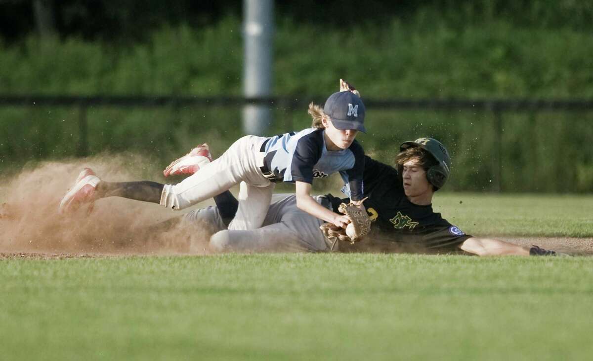 Milford second baseman Jack D'Avignon is upended by New Milford's Kyle Murphy in game 2 of the 13-year-old Babe Ruth baseball state tournament championship played at the Fairfield Hills Complex in Newtown. Friday, July 13, 2018