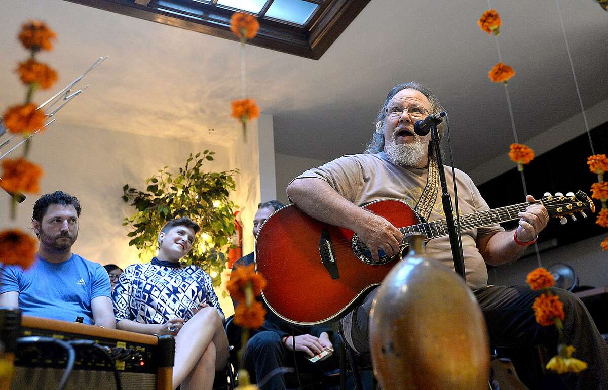 Musician Larry Dunaway performs during the first "Eclectic Open Mic Night" at The Music Studio in Beaumont. The event offered a spectrum of artists and performers, ranging from comedians to musicians to poets, dancers and artists to offer their unique talents. A crowd filled the seats, hallways and sitting rooms at the studio for the first showcase of area talent. Friday, July 13, 2018 Kim Brent/The Enterprise