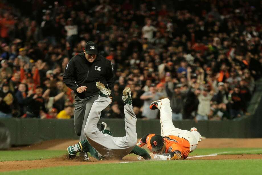   Giants third baseman Pablo Sandoval can not play as Stephen Piscotty of Oakland goes back in time. Photo: Santiago Mejia / The Chronicle 
