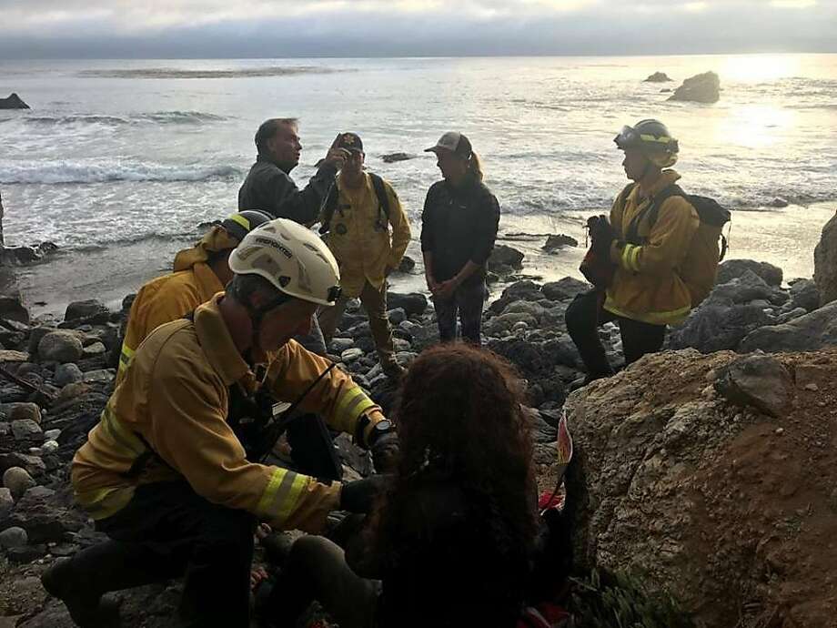   Rescue teams tend to Angela Hernandez at the bottom of a cliff in Monterey County. Hernandez disappeared on July 6 while she was driving from Portland to visit her sister in Southern California. Photo: Monterey County Sheriff's Office 
