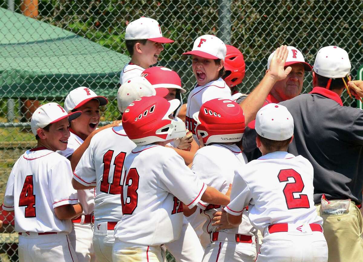 Fairfield American celebrates its win over Trumbull National in District 2 little league baseball action at Unity Park in Trumbull, Conn., on Saturday July 14, 2018.