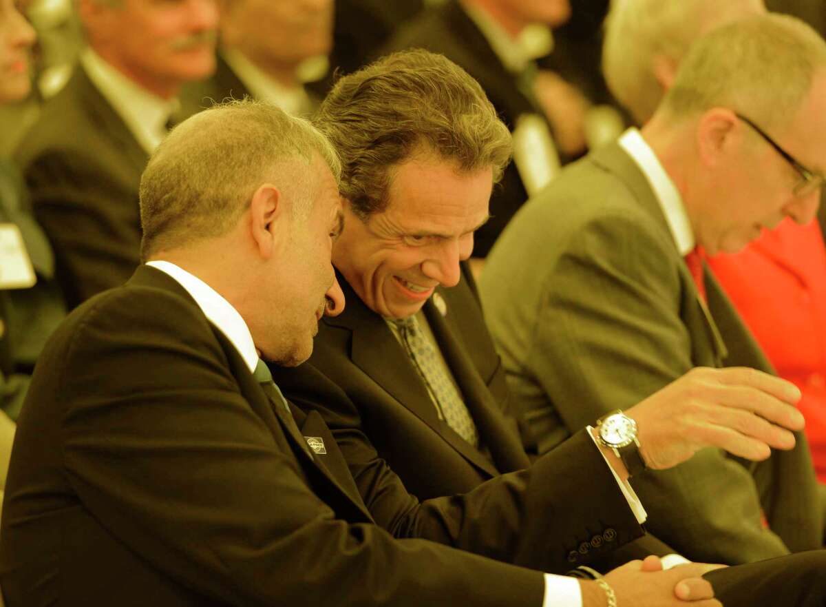 Governor Andrew Cuomo, right shares a laugh with Alain E. Kaloyeros senior vice president and chief executive officer, College of Nanoscale Science and Engineering at the College of Nanoscale Science and Engineering in Albany, N.Y. before the governors Tax-Free initiative presentation. (Skip Dickstein/Times Union)