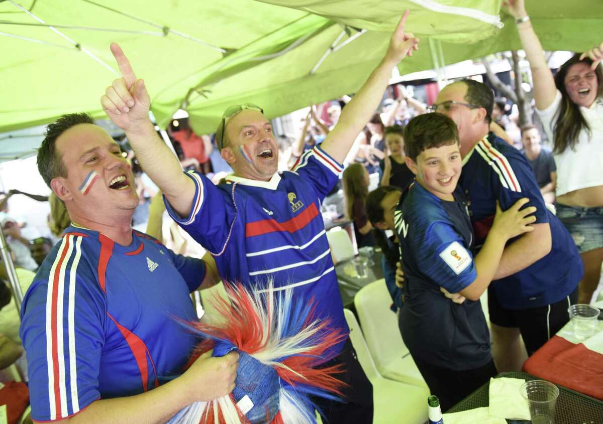 France fans celebrate as time expires in France’s 4-2 win over Croatia in the FIFA World Cup final viewing party outside of Capriccio Cafe in Stamford on Sunday.