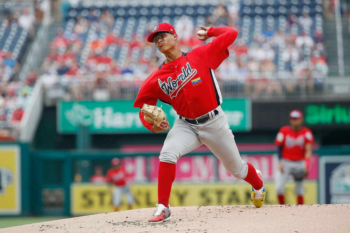WASHINGTON, DC - JULY 15: Starting pitcher Jesus Luzardo #9 of the Oakland Athletics and the World Team works the first inning against the U.S. Team during the SiriusXM All-Star Futures Game at Nationals Park on July 15, 2018 in Washington, DC. (Photo by Patrick McDermott/Getty Images)