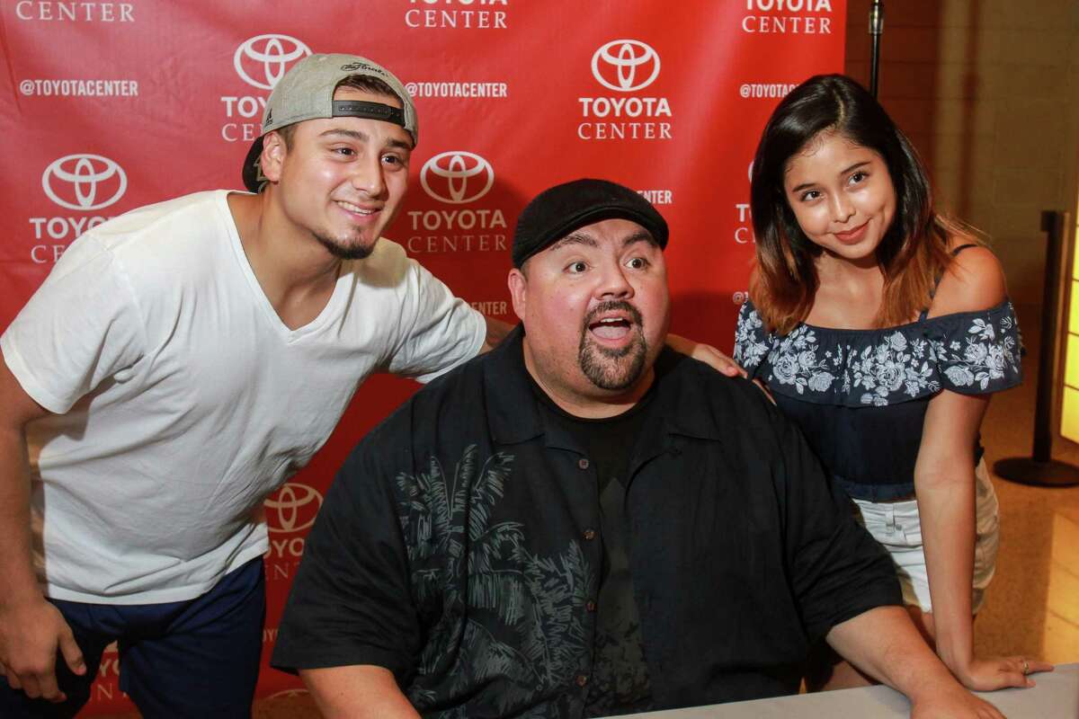 Carlos Robles, from left, comedian Gabriel "Fluffy" Iglesias, and Jocelyn Magdaleno during his birthday celebration at Toyota Center.