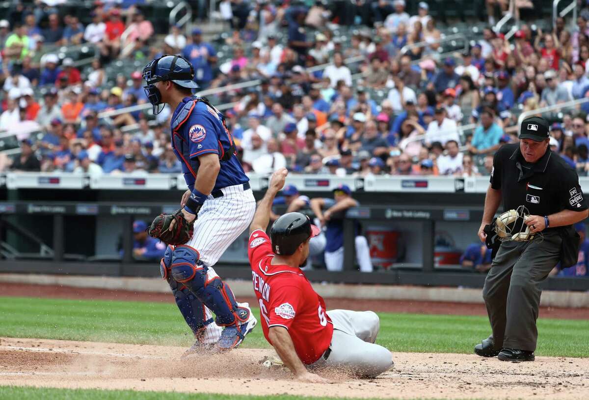 NEW YORK, NY - JULY 15: Anthony Rendon #6 of the Washington Nationals scores against Devin Mesoraco #29 of the New York Mets in the seventh innng during their game at Citi Field on July 15, 2018 in New York City. (Photo by Al Bello/Getty Images)