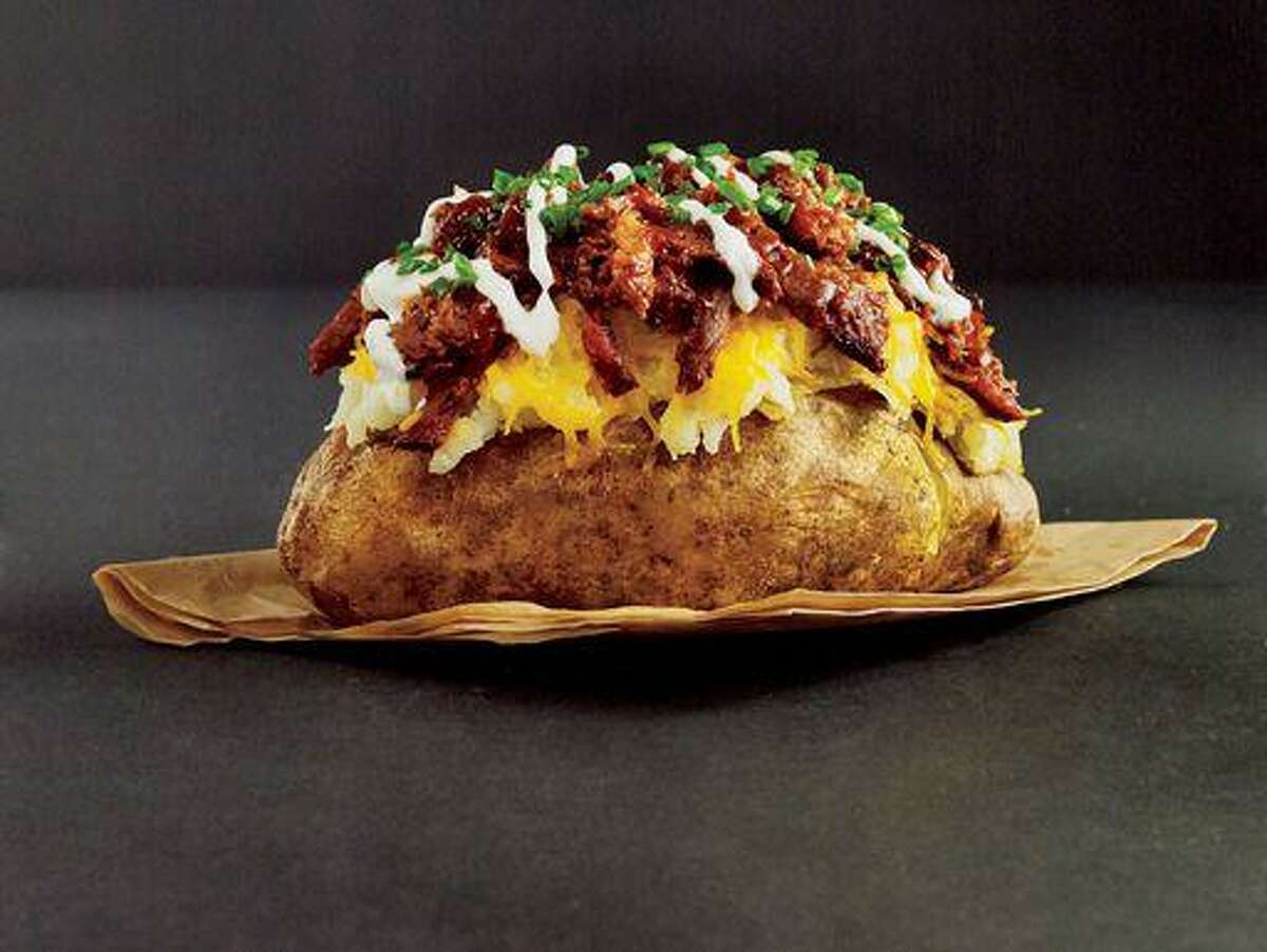 The menu at True Texas BBQ located inside the H-E-B on Kingwood Drive has loaded baked potatoes, pulled pork sandwiches, BBQ spread and brisket and ribs.