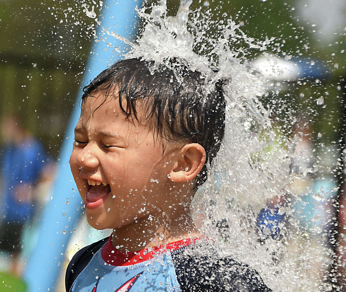 Ethan Reynante, 2, of Cohoes cools off in the new splash pad after a ribbon-cutting for the Town of Colonie's new water playground at the Colonie Mohawk River Park on Monday, July 16, 2018 in Cohoes, N.Y. (Lori Van Buren/Times Union)
