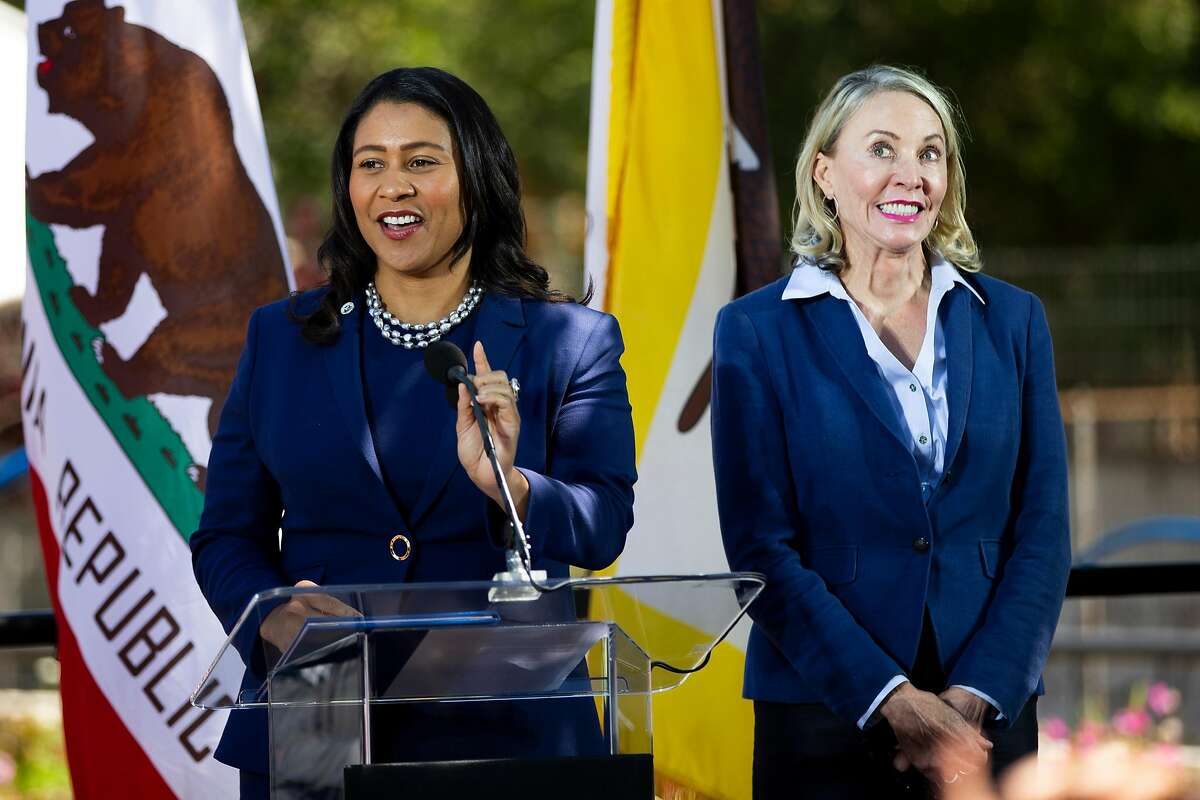 Newly appointed District 5 Supervisor Vallie Brown, right, reacts as she was being introduced by Mayor London Breed during Brown's swearing-in ceremony at the Hayes Valley Playground in San Francisco, Calif. on Monday, July 16, 2018.