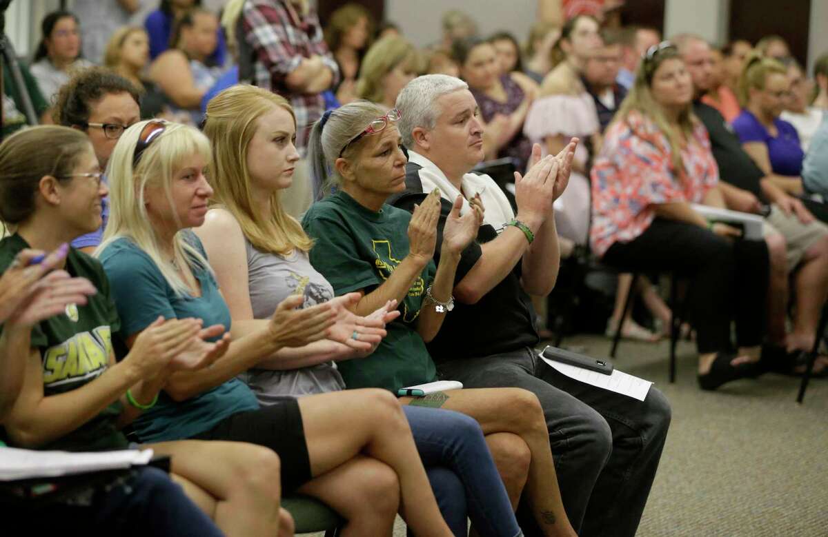 People attend the Santa Fe ISD trustees meeting Monday, July 16, 2018, in Santa Fe. They voted to install metal detectors in each of the district's schools.