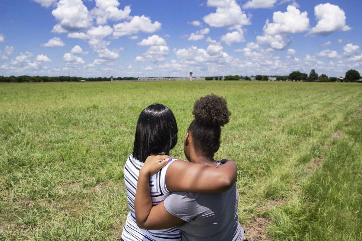 Crishelle Young, 14, right, hugs her mother, LaKristle Dilworth, outside the TDCJ Allan B. Polunsky Unit where Young's father, Christopher Young, is on death row July 14, 2018 in Livingston. Christopher Young's execution, for the 2004 murder of Hasmukhbhai Patel, an owner of a San Antonio mini-mart, is scheduled for Tuesday, July 17. (Michael Ciaglo / Houston Chronicle)
