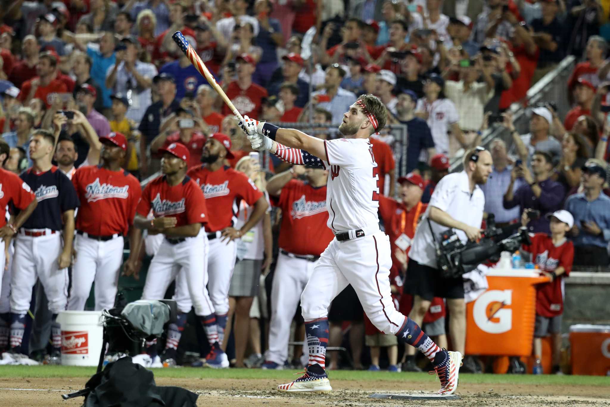 Washington Nationals Bryce Harper celebrates his winning hit during the  Major League Baseball Home Run Derby, Monday, July 16, 2018 in Washington.  (AP Photo/Alex Brandon)