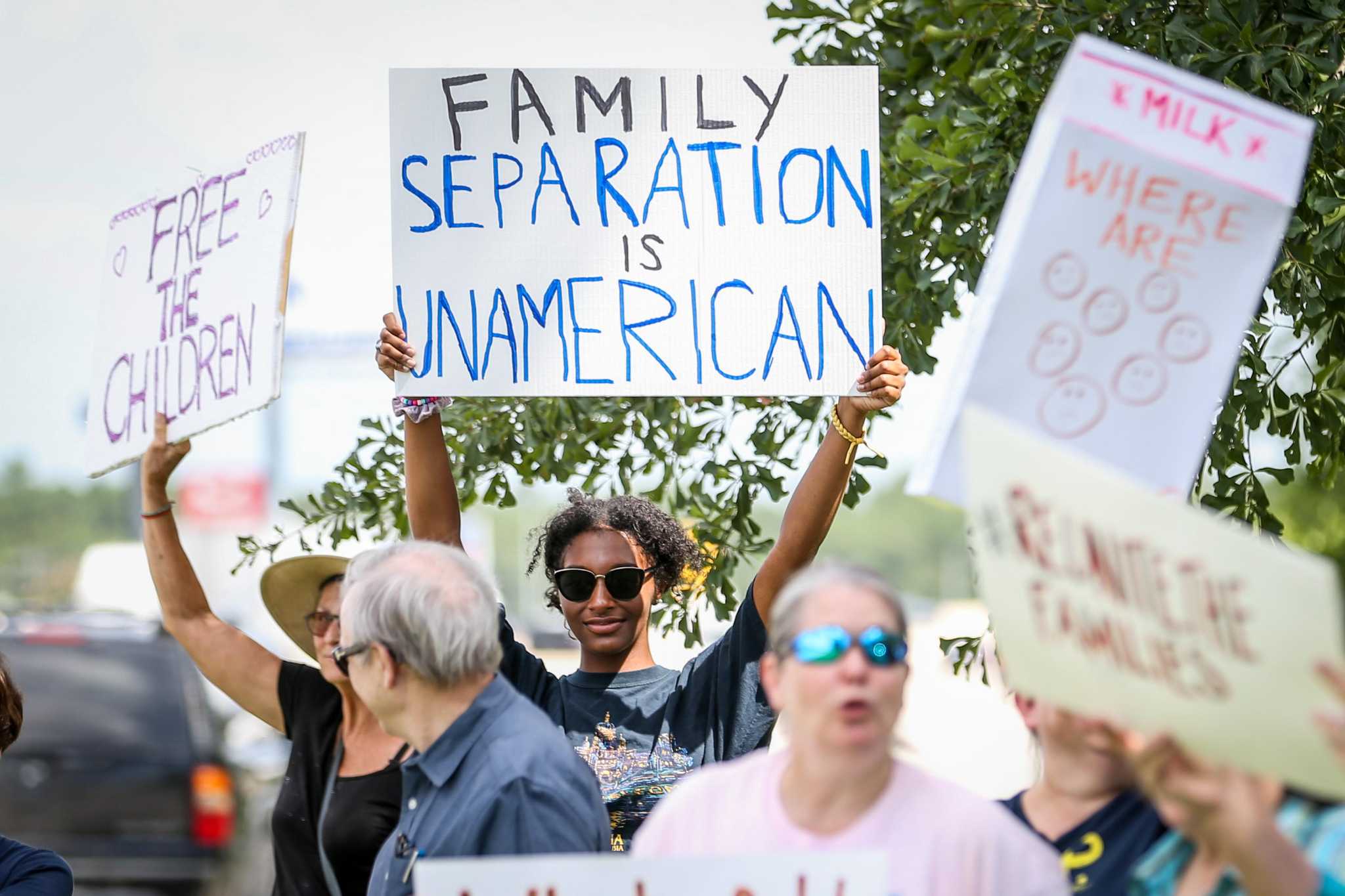 Protestors demonstrate outside of Rep. Brady’s Conroe office