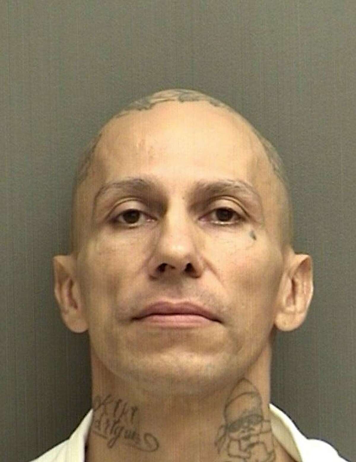 In a photo from the Houston Police Department, Jose Gilberto Rodriguez in a booking photo after his arrest. Rodriguez, 46, was arrested as the suspect in a series of attacks that included three murders, a home invasion and an assault on a city bus. 