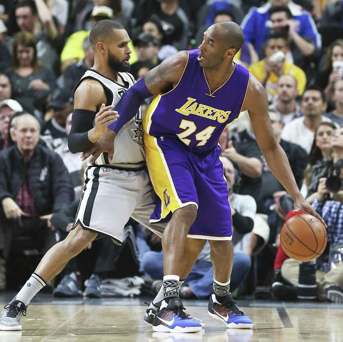 Former Los Angeles Lakers star Kobe Bryant, pictured with the Spurs’ Patty Mills in this 2016 file photo, is one of the high-profile backers in real estate data analytics firm HouseCanary Inc. HouseCanary earlier this year won a $706 million verdict in a jury trial in Bexar County.