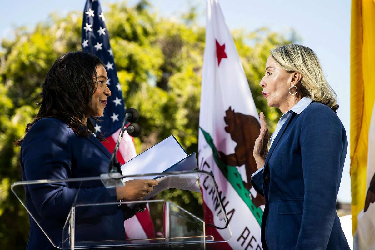 San Francisco Mayor London Breed, left, administers the oath of office to former legislative aide Vallie Brown as the new District 5 supervisor during a swearing-in ceremony at the Hayes Valley Playground in San Francisco, Calif. on Monday, July 16, 2018.