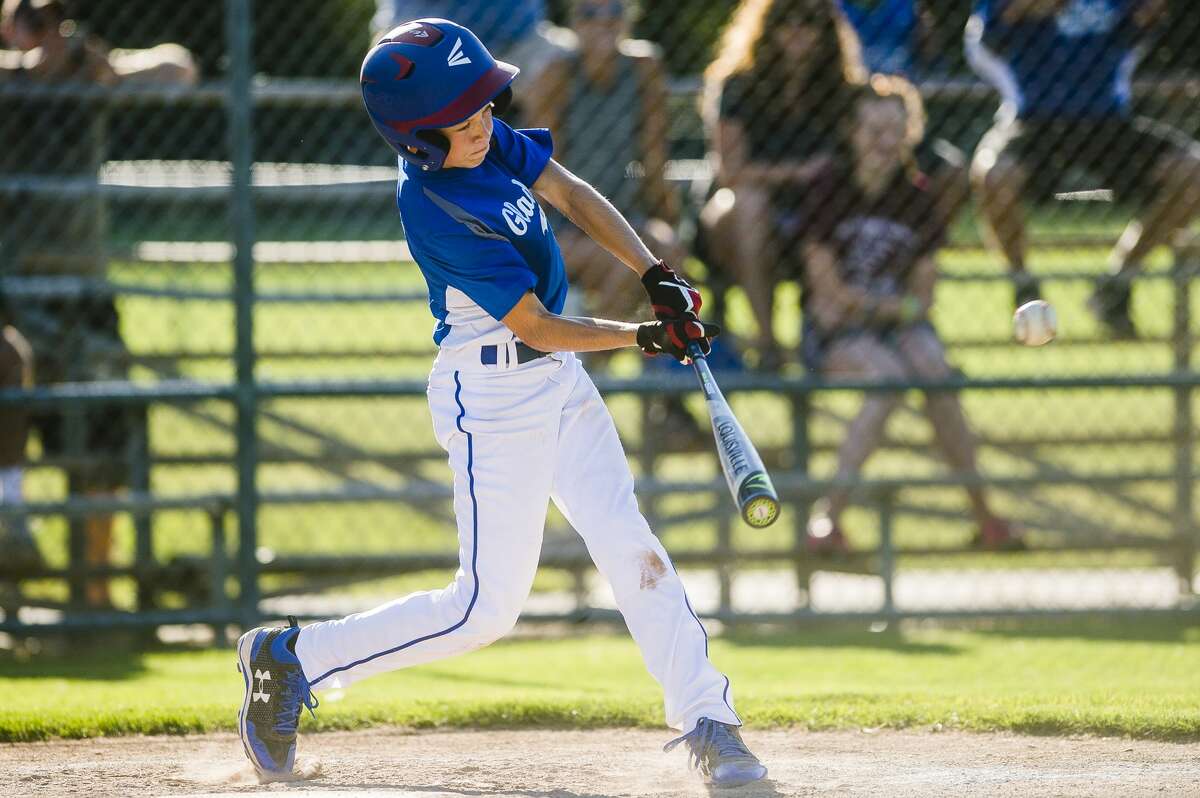 Gladwin's Seth Mead swings on a pitch during his team's 11-year-old Little League Baseball district final victory over Midland Northeast on Tuesday, July 17, 2018 at Plymouth Park. (Katy Kildee/kkildee@mdn.net)
