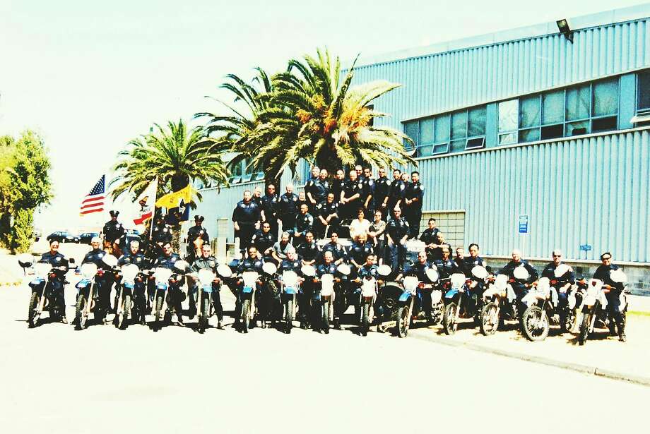 Members of the San Francisco Police Department’s Special Operations Tactical Company take a group photo outside Building 606 at the former Hunters Point Naval Shipyard. Some officers who worked in the building worry that hazards in the shipyard may have compromised their health. Photo: San Francisco Police Department
