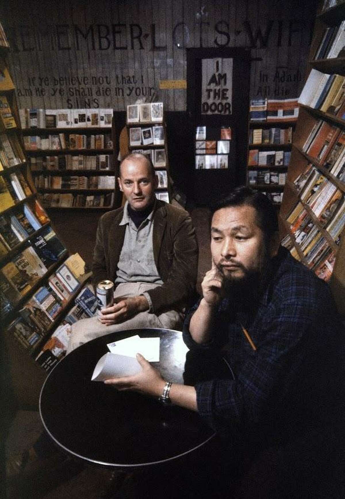 Lawrence Ferlinghetti and manager Shigeyoshi Murao. The City Lights is the mecca for all beat writers and many of them receive their mail here. The shop use to be a mission house hence the sign on the wall unaltered in the past 50 years, reading, “Remember Lot’s wife.”