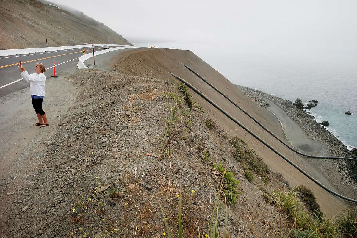 First Cars Whiz Along California’s New Highway 1 Coastal Road At Big Sur