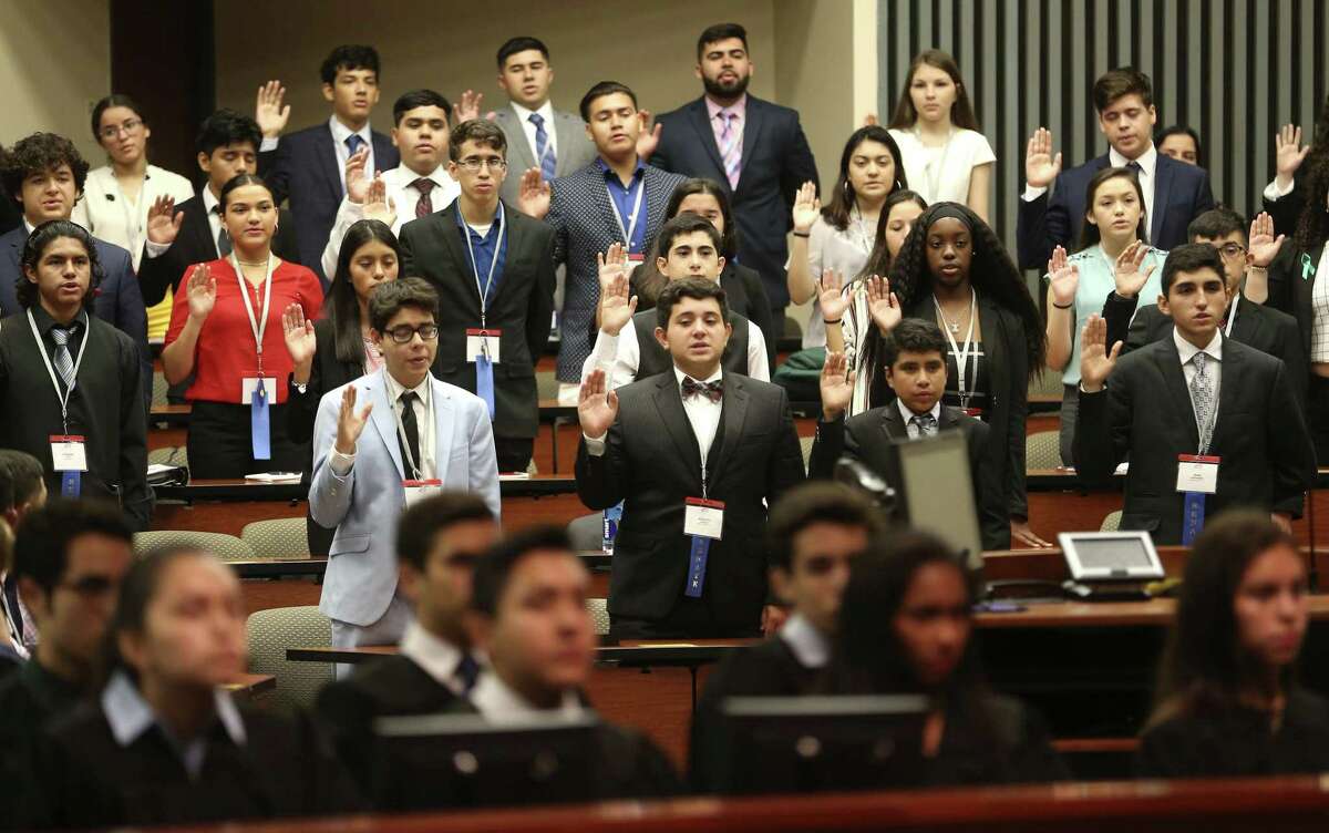 The senators of the National Hispanic Institute's annual Texas Lorenzo de Zavala Youth Legislative Session, a mock legislative session for high-performing Latino high school students, are sworn into office at St. Mary's University Law School during the opening ceremonies of the three-day event.