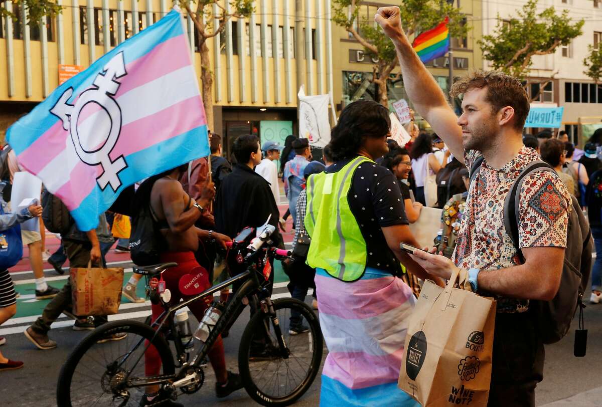 Joe Wadlington makes a fist in support of 15th annual Trans March , Friday, June 22, 2018, in San Francisco, Calif.