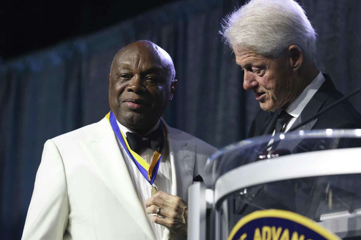 President Bill Clinton present former San Francisco Mayor Willie L. Brown the Thalheimer Spingarn Medal during the 109th annual National Association for the Advancement of Colored People convention at the Henry B. Gonzalez Convention Center in San Antonio, Texas, Wednesday, July 18, 2108.