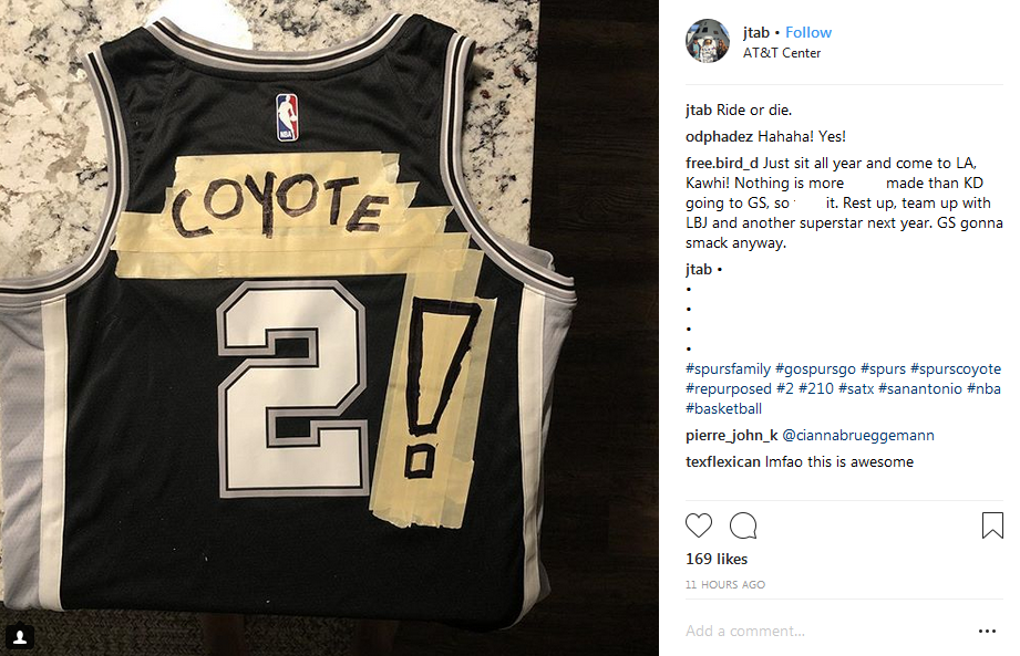 A man makes NBA jerseys for newly-acquired Toronto Raptors player Kawhi  Leonard at the Real Sports Apparel store at the Scotiabank Arena, in  Toronto, Friday July 20, 2018. THE CANADIAN PRESS/Mark Blinch