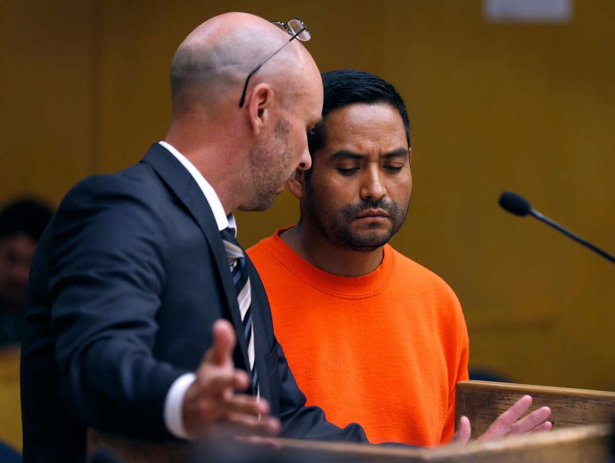 Deputy public defender Eric Quandt confers with Orlando Vilchez Lazo during an appearance in Department 9 of Superior Court for a hearing at the Hall of Justice in San Francisco, Calif. on Tuesday, July 17, 2018. Lazo�s arraignment on multiple rape charges was postponed two days and bail was revoked.
