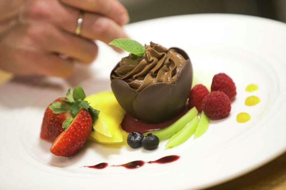 Two Lake Houston Area Restaurants Pare In Restaurant A Grand Marnier Mousse With Fresh Berries Is Plated At Chez Nous On Dec 5