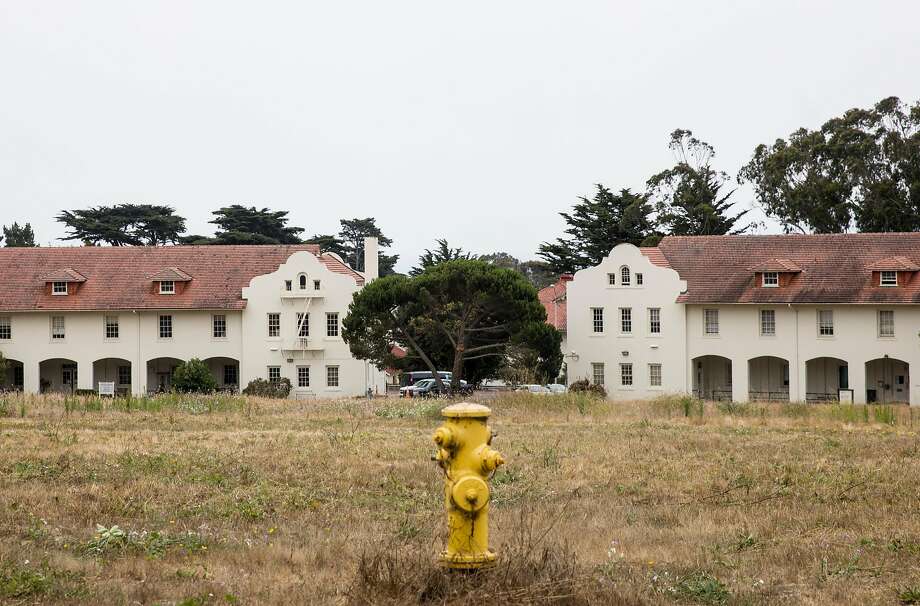 A large field sits between original barracks buildings at Fort Scott in the Presidio of San Francisco, Calif. Tuesday, July 17, 2018. Photo: Jessica Christian / The Chronicle