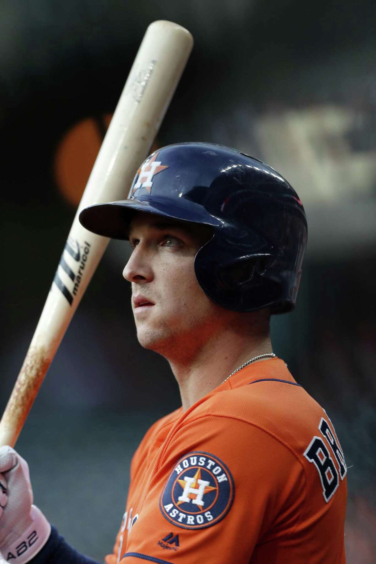 Houston Astros' Alex Bregman, left, points to a camera after