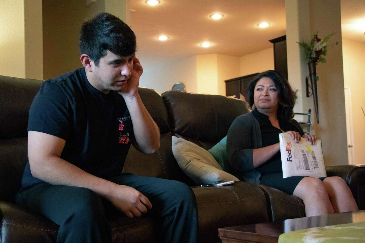 Peyton Howell, 17, listens to his mother Theresa recount the emotional journey toward medical treatment of hepatitis C, a chronic liver infection he contracted in utero.