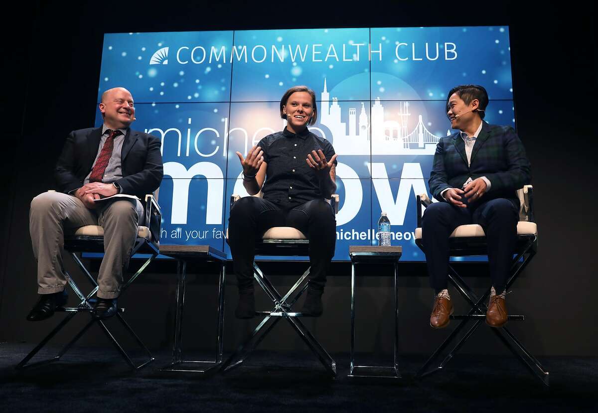 49ers assistant coach Katie Sowers (middle) speaks to Commonwealth Club vp of media and editorial John Zipperer (left) and tv and radio host Michelle Meow (right) at the Commonwealth Club of San Francisco on Tuesday, July 17, 2018 in San Francisco, Calif.